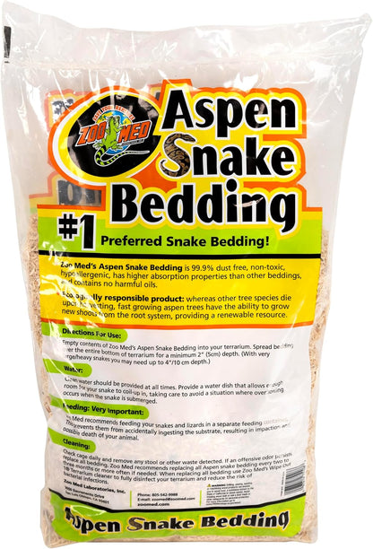 Natural shredded aspen wood reptile substrate spread inside a clean terrarium enclosure