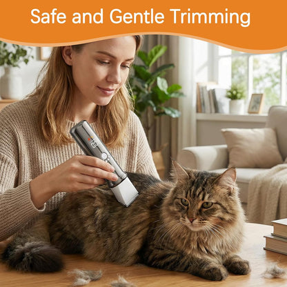 Quiet motor pet hair shaver being used to groom sensitive areas on a cat