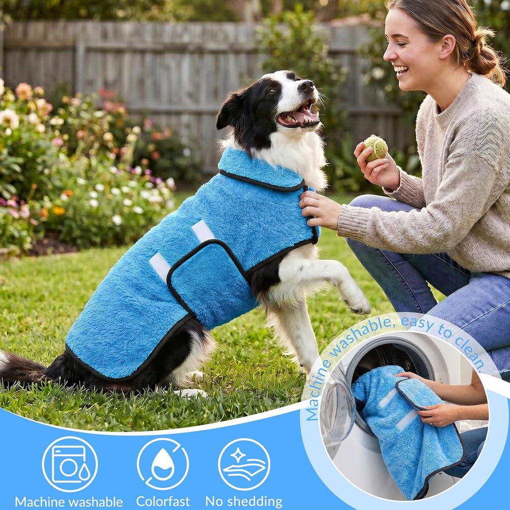 A medium sized dog resting comfortably wearing the blue Bienbee drying gown like pajamas.