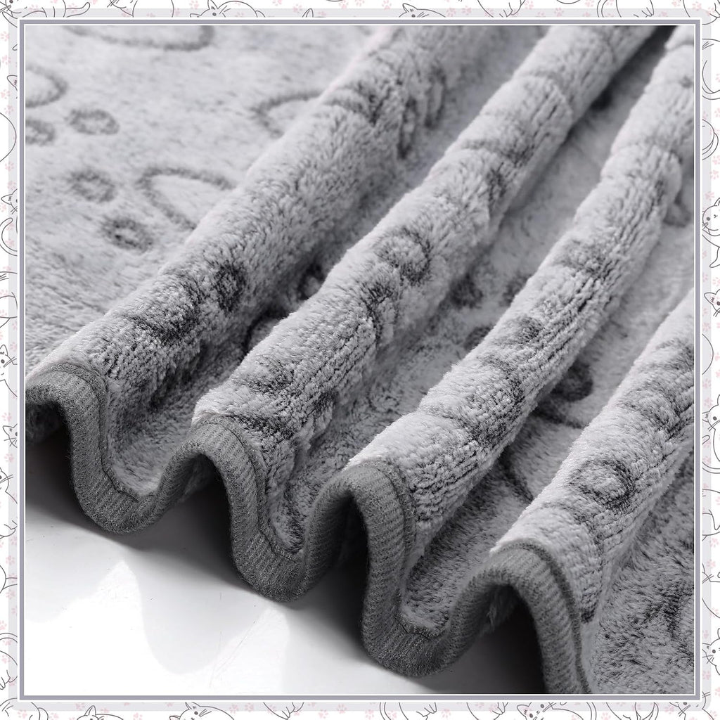 Small puppy resting comfortably on the soft Tegeme paw pattern flannel bed liner