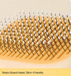 Ergonomic non slip handle of duck pet brush being held comfortably.