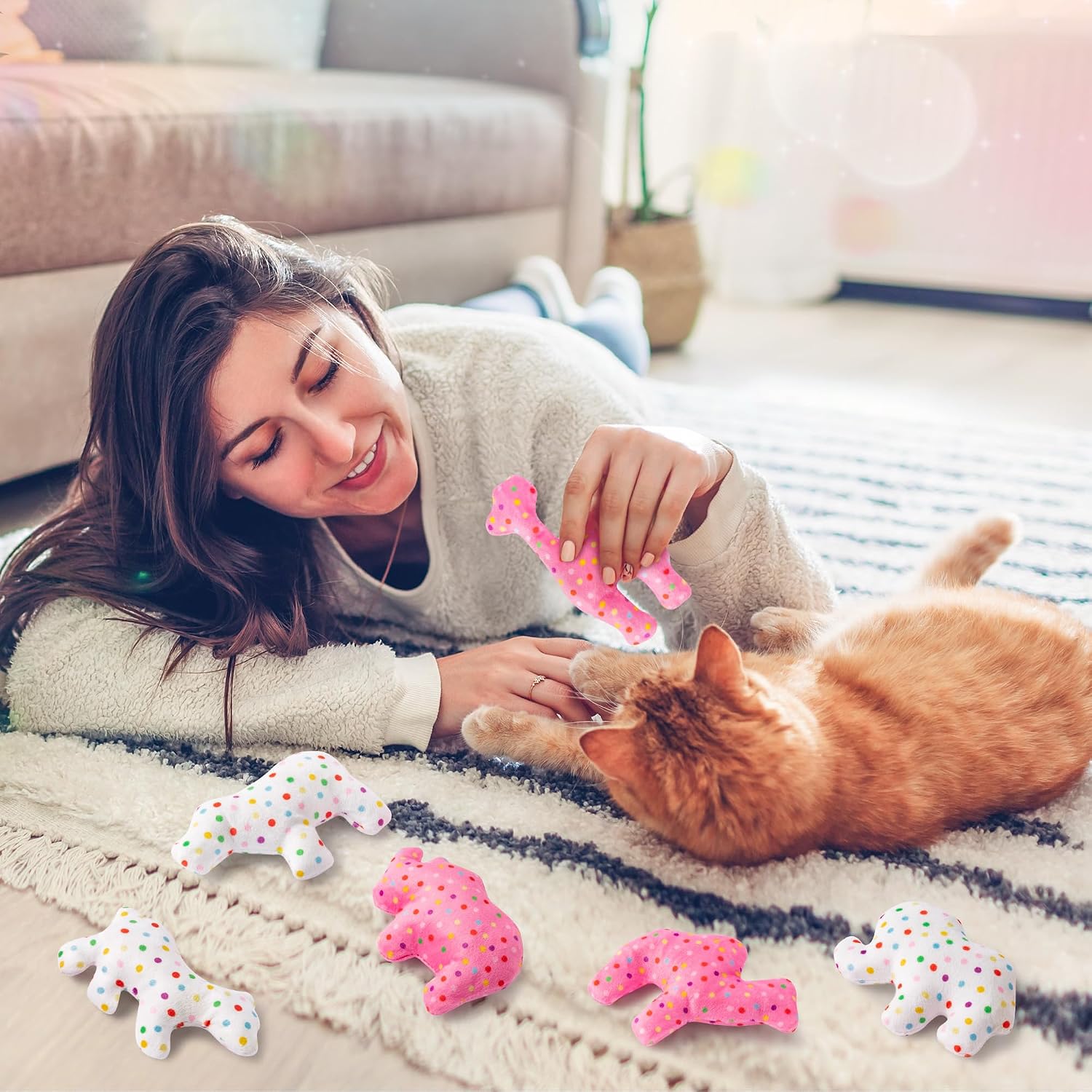 Kitten batting at a frosted cookie catnip toy