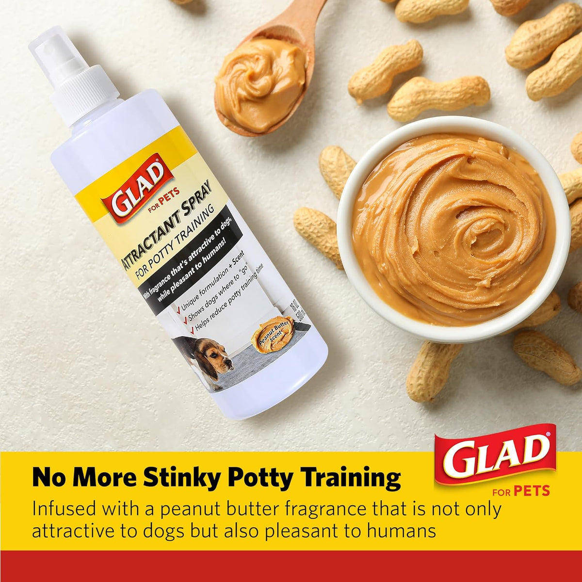 Puppy being trained with Glad potty spray on grass