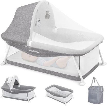 Ezebaby portable travel bassinet front view showing the grey mesh design and padded mattress.