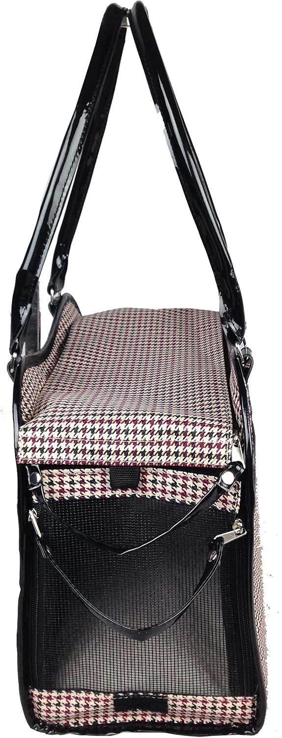 Small dog sitting inside Pet Life exquisite carrier