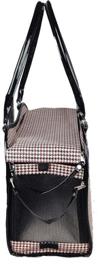 Small dog sitting inside Pet Life exquisite carrier