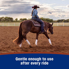 Buffing leather riding boots with a soft cloth