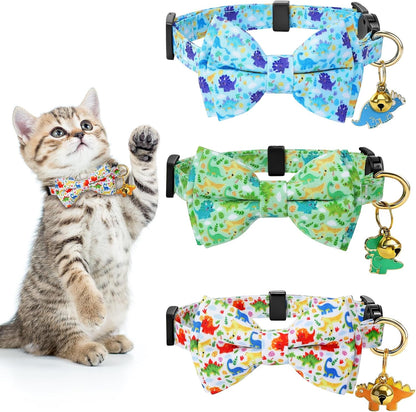 A small puppy wearing the blue dinosaur pattern version of the adjustable safety buckle collar.