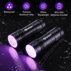 Compact black light torch inspecting carpet for hidden pet urine stains.