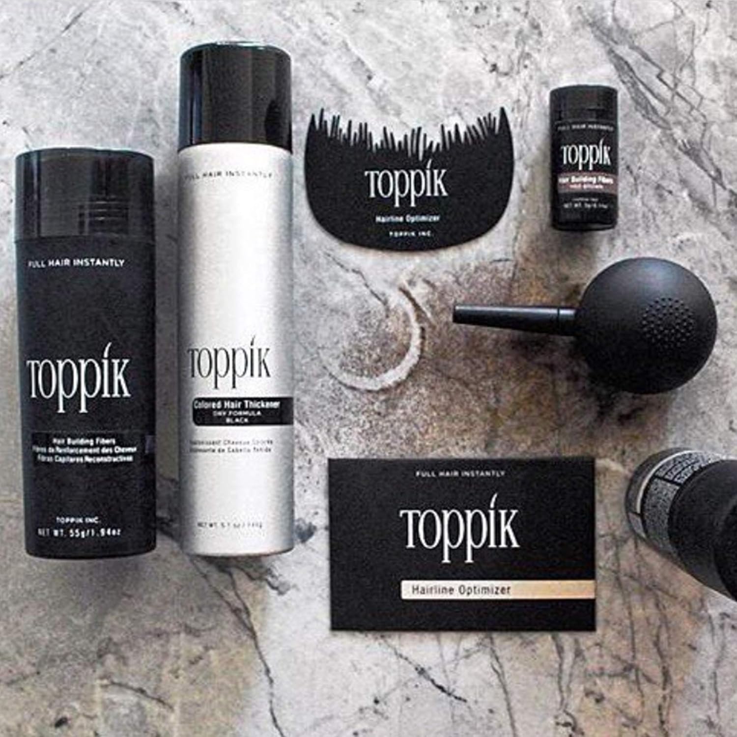 Toppik fine mist hair styling spray showing the official product labels and sizing.