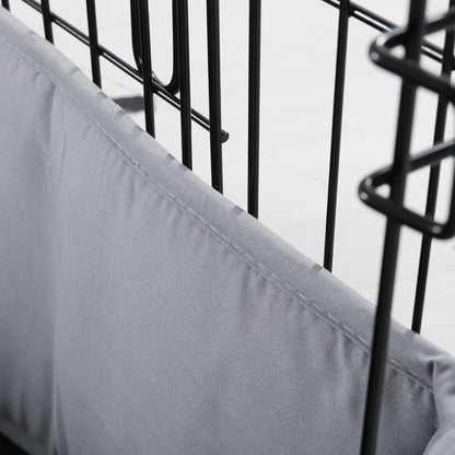 Small dog resting comfortably next to the half height gray kennel bumper guard