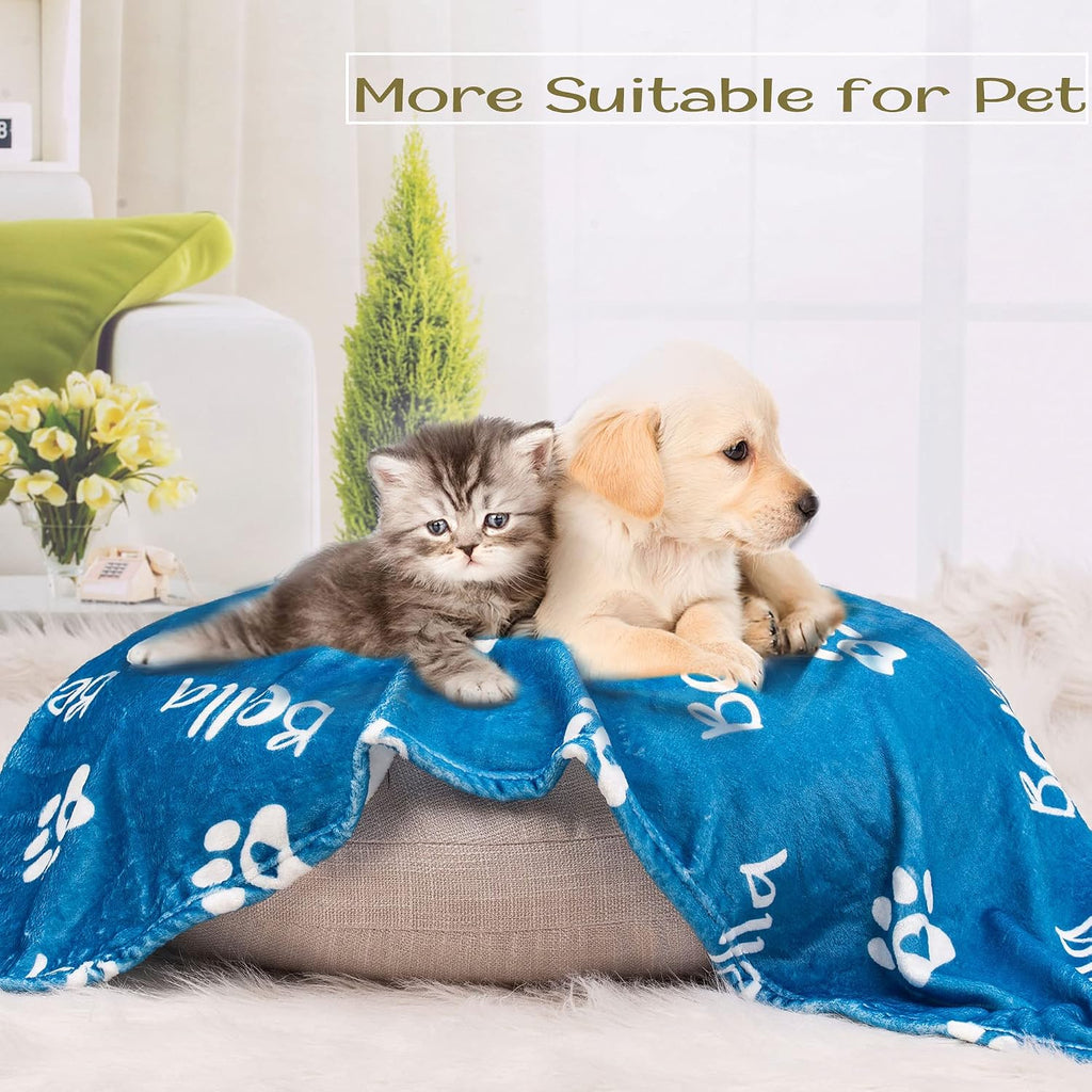 A small puppy resting comfortably on the customized blue flannel dog blanket.