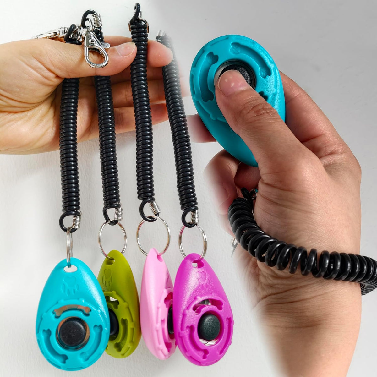 Purple and Pink animal behavior training clickers close up view.