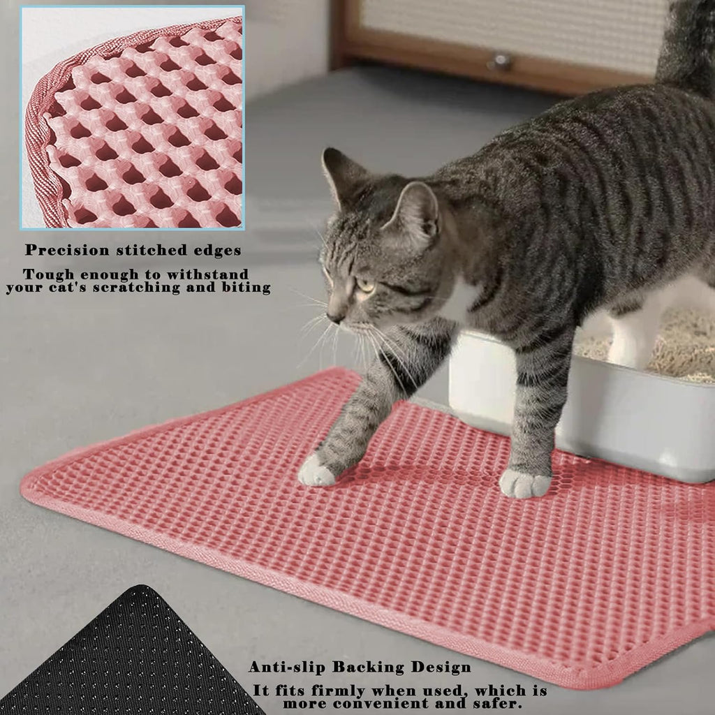 Pouring trapped cat litter back into a litter box from the open-edge mat.