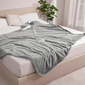 Gogobunny waterproof pet blanket grey front view spread on a bed