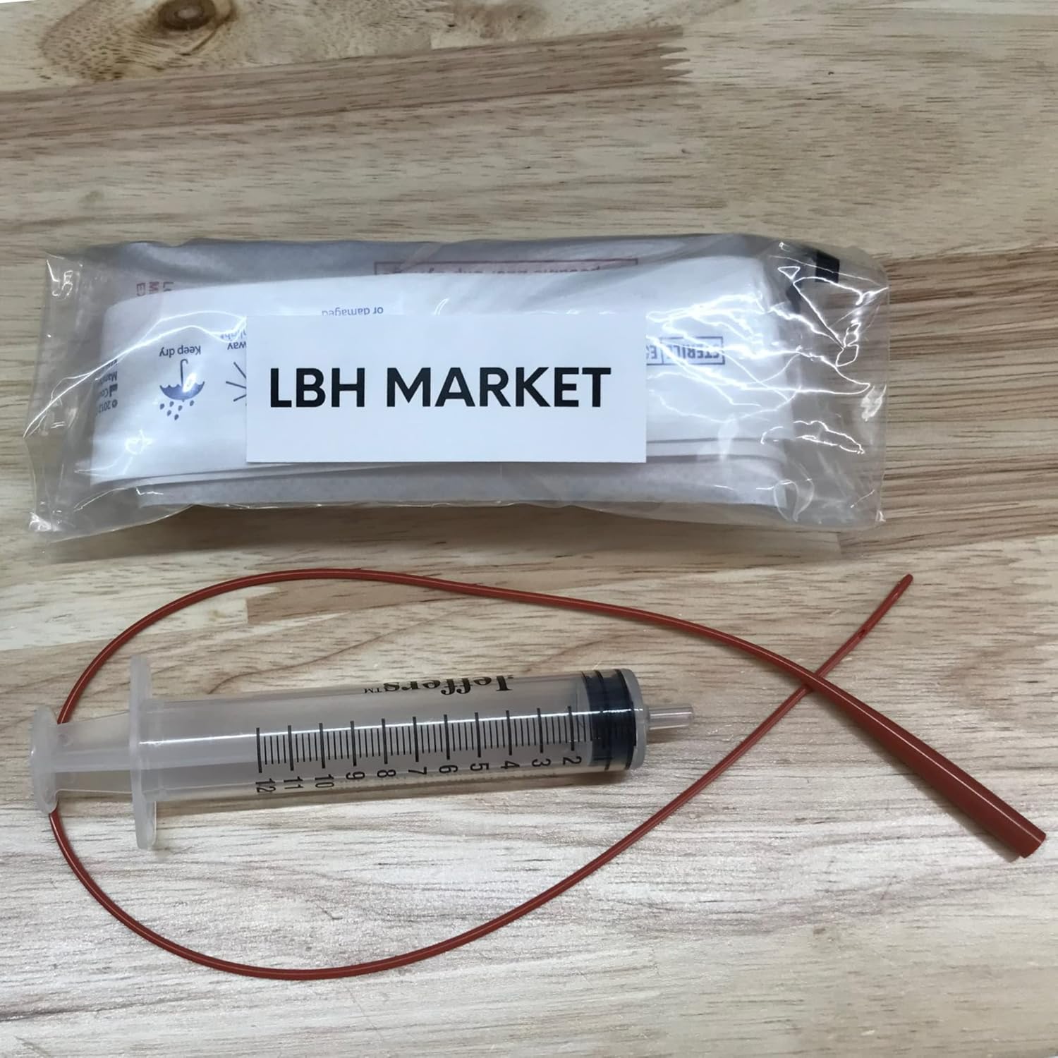 Close up of the non traumatic rounded tip on the five French pet feeding catheter
