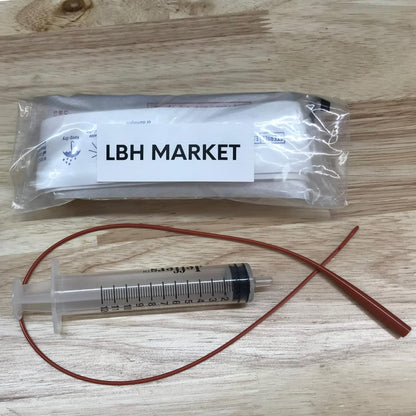 Close up of the non traumatic rounded tip on the five French pet feeding catheter