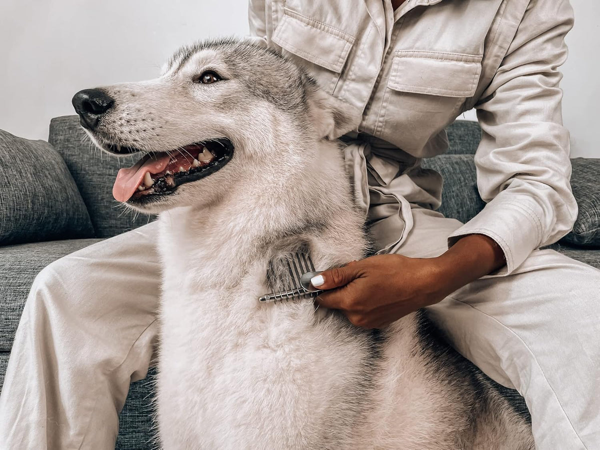 Tuff Pupper authentic imported pet grooming comb highlighting its precision control grip.