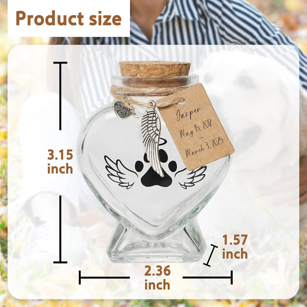 Heart shaped glass pet urn for dog fur and cat whiskers on a wooden shelf