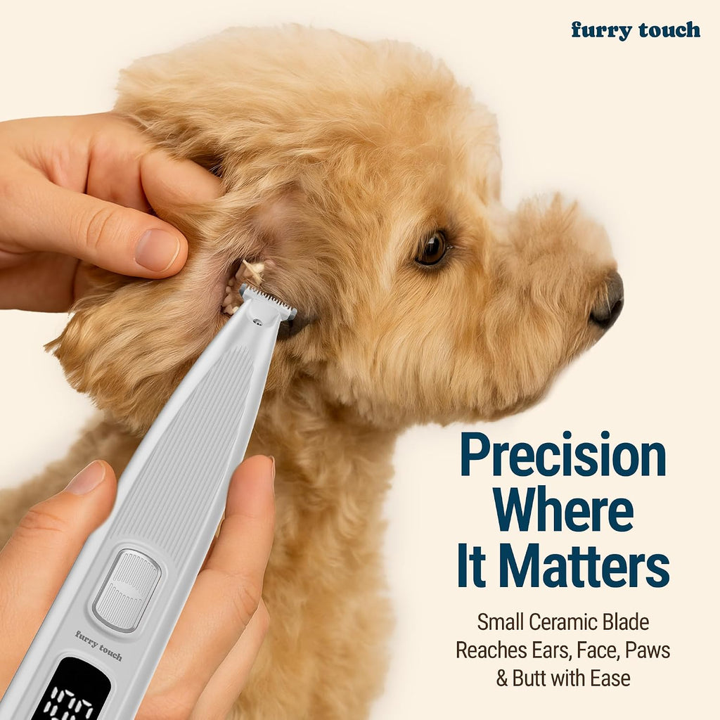 Furry Touch cordless pet trimmer highlighting the integrated LED light illuminating a dog paw pad during grooming.