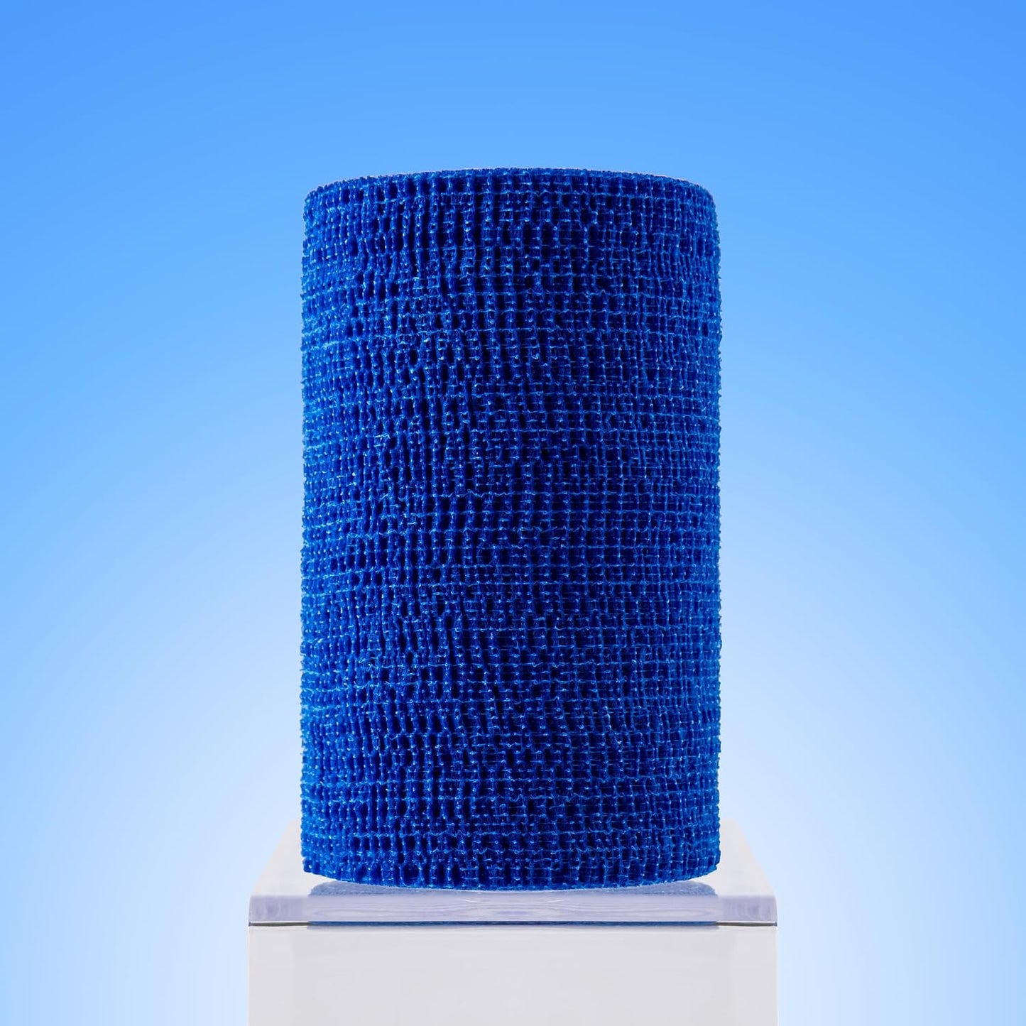 Four rolls of blue veterinary bandage wrap by Ovik Health