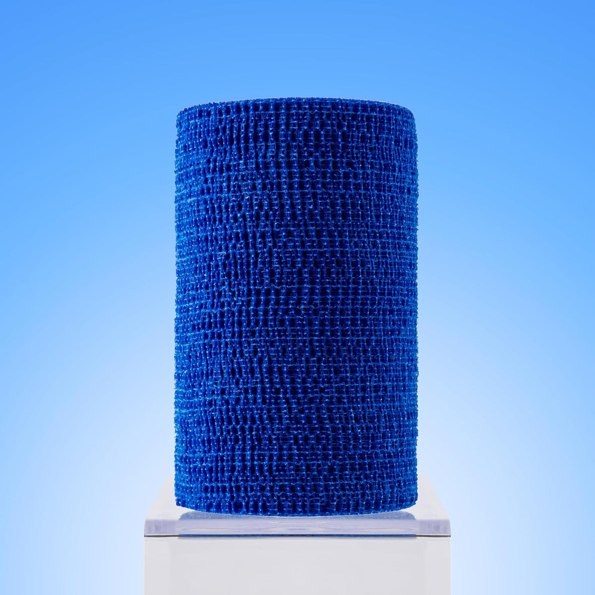 Four rolls of blue veterinary bandage wrap by Ovik Health