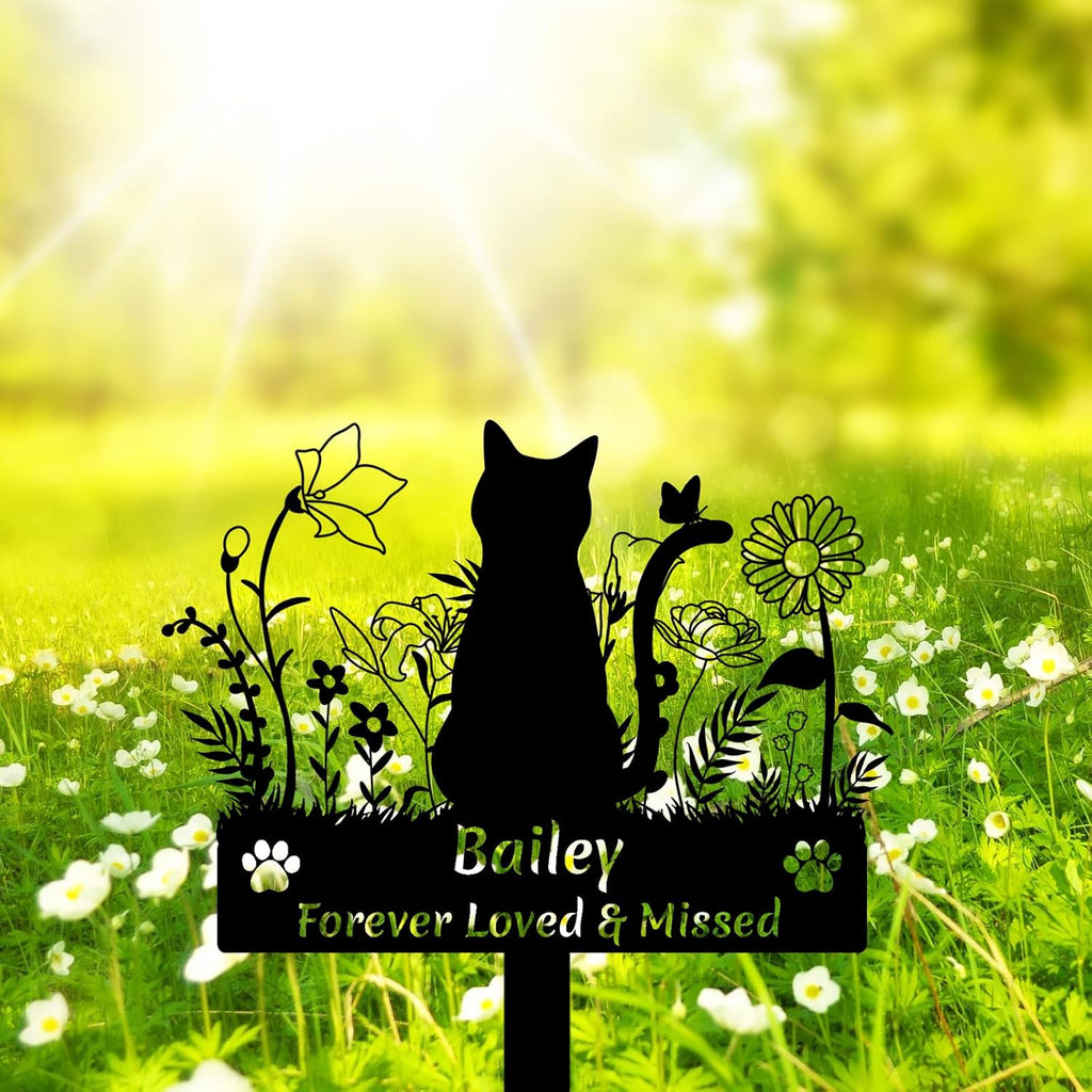 Close up of laser-cut cat silhouette on metal grave marker