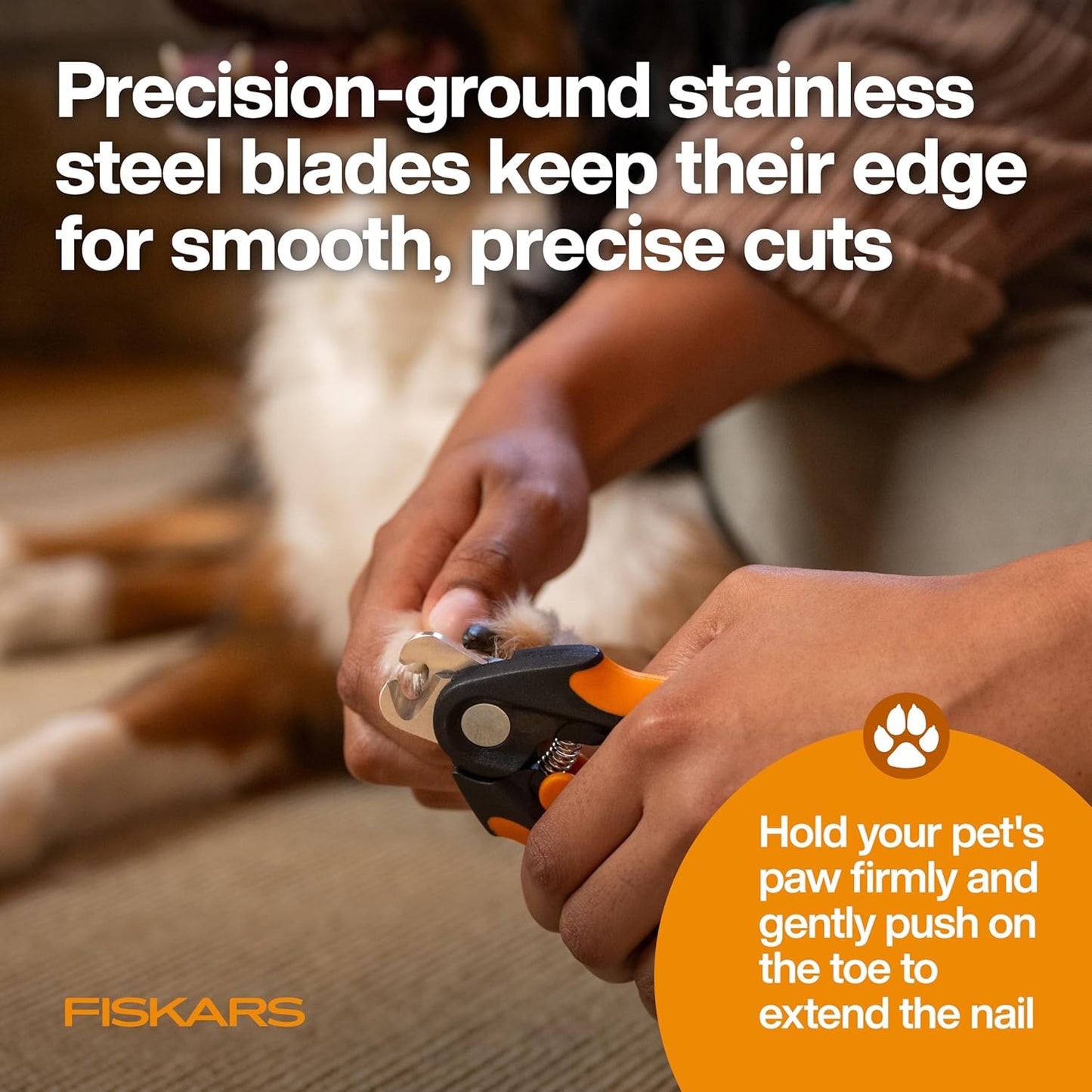 Fiskars pet nail clippers in hand demonstrating ergonomic grip