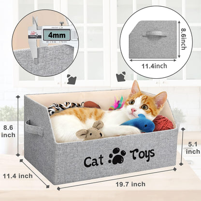 Collapsible grey linen pet storage basket filled with cat toys and treats