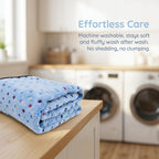 Authentic imported durable polyester flannel blanket inside a small pet crate.
