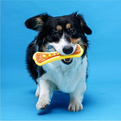 Small dog playing with Hartz dental chew toy