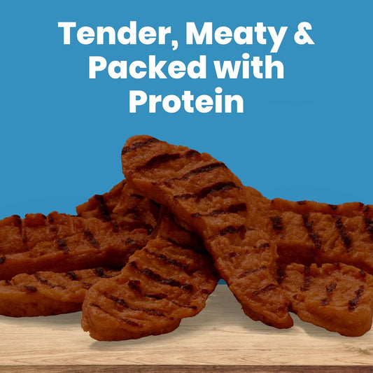 Soft and tender fire grilled style dog snack pieces displayed next to the Blue Buffalo resealable bag.