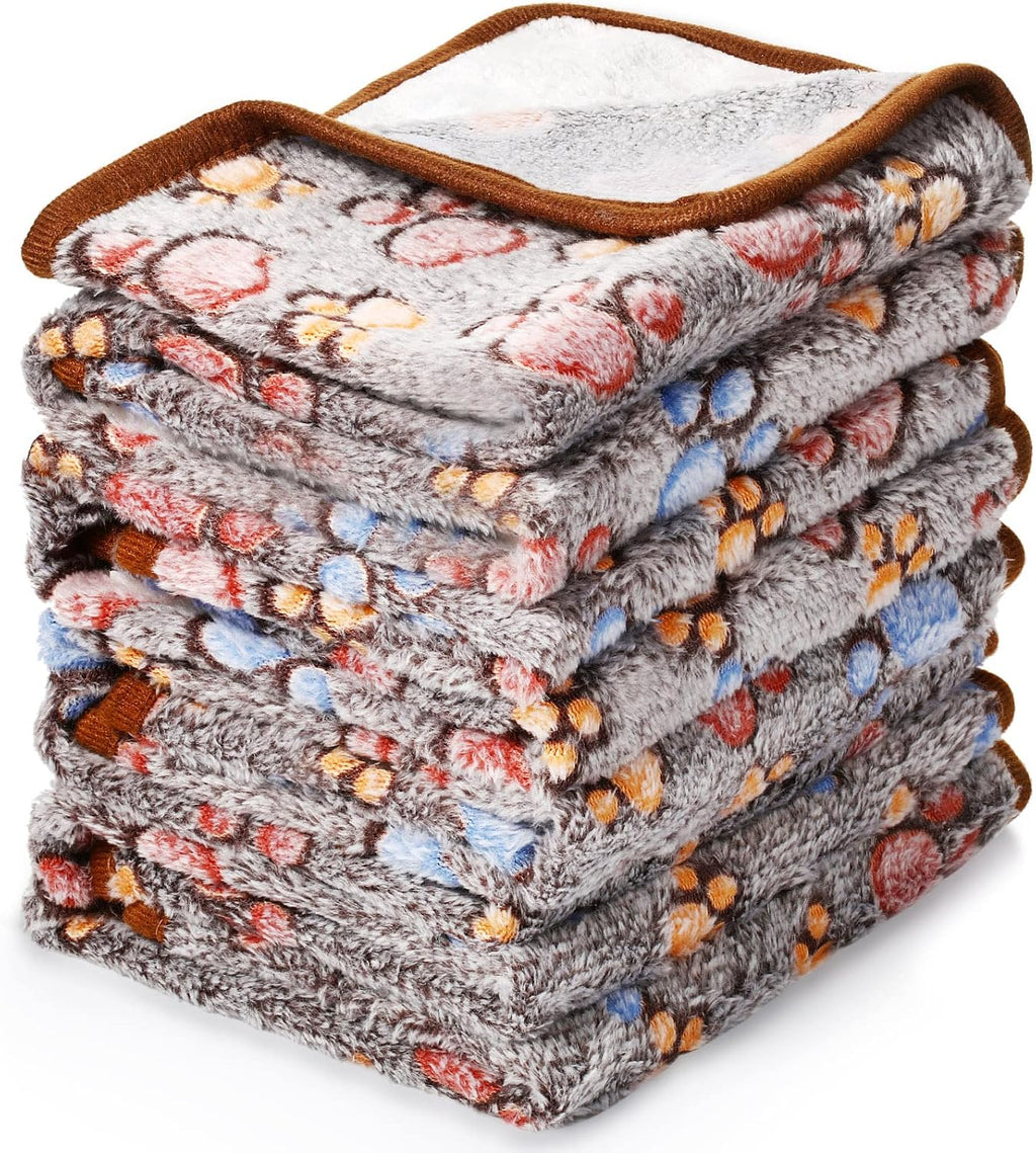 Mixed color pet blankets placed inside a compact dog travel carrier.