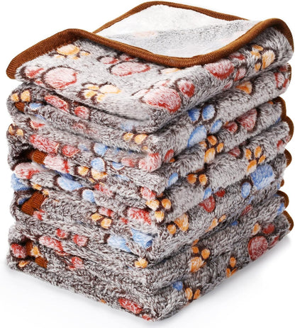 Mixed color pet blankets placed inside a compact dog travel carrier.