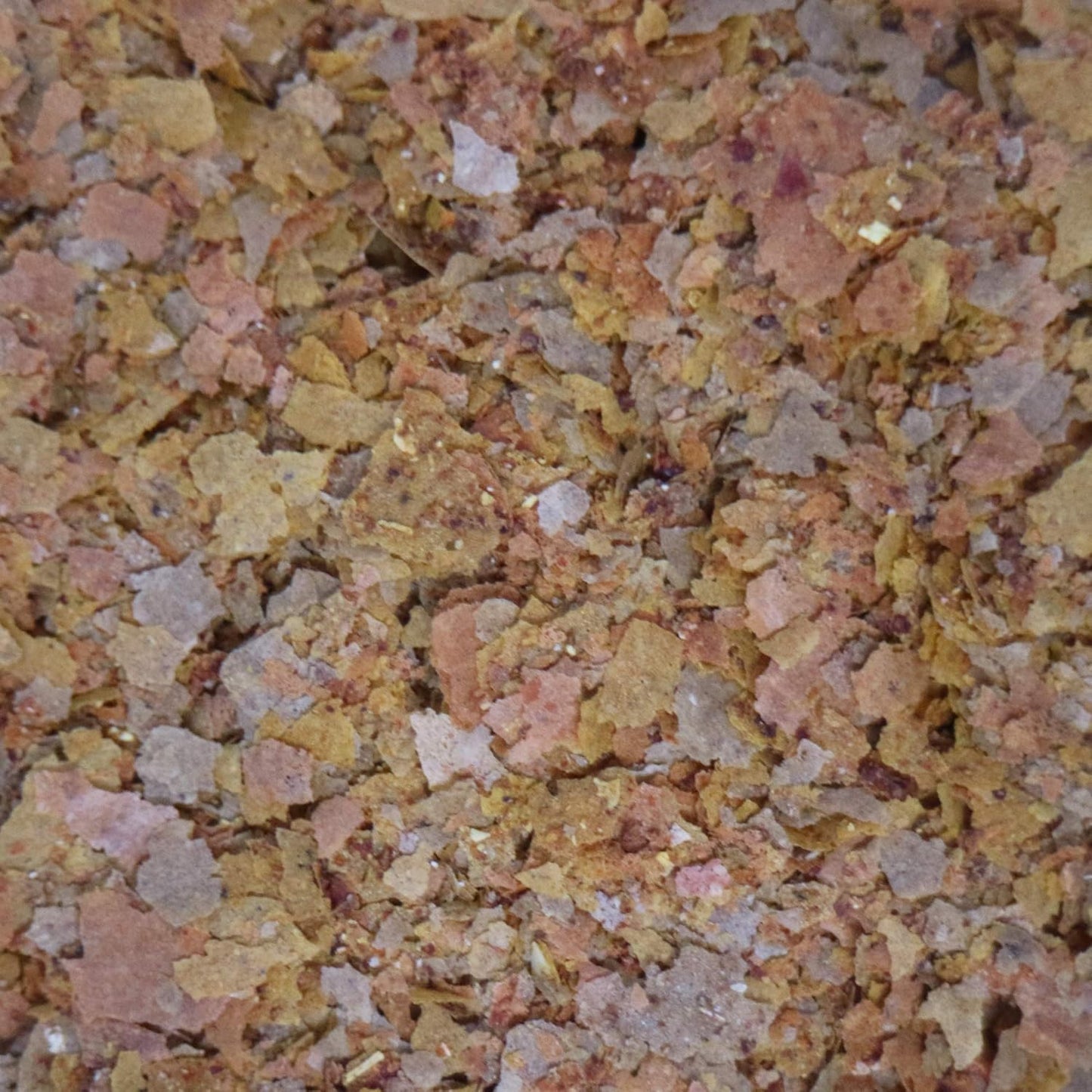Side view of API Tropical Flakes bottle showing ingredient list