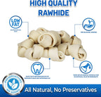 Small four to five inch natural beef hide dog chew bones close up