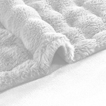 Fluffy cat resting on the plush white faux rabbit fur pet throw blanket.