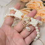 Imported imitation pearl necklace for small dogs and cats captured as a lifestyle photo prop.