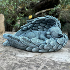Youruitom angel cat statue grave marker placed outdoors in a garden setting