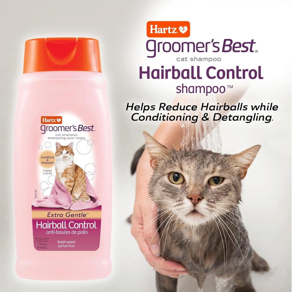 Cat receiving a gentle bath with Hartz shampoo