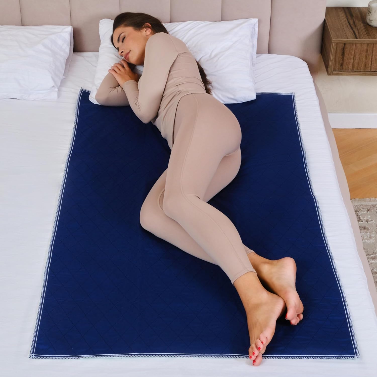 Inspire waterproof mattress protector front view showcasing the extra large dark navy blue quilted surface.