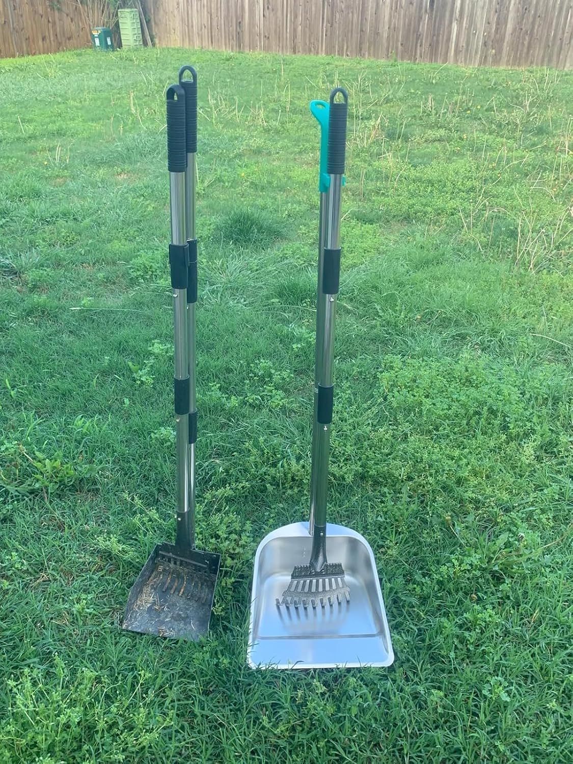 Close up of the thirty six inch long extended handle on the metal pet waste remover eliminating the need to bend over.