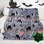 IEOEO black cat Halloween blanket front view showcasing the glowing print pattern.
