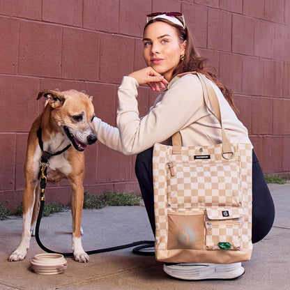 Cleverpup checkerboard pet gear tote with ventilated mesh ball pocket.