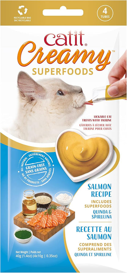 Cat owner hand feeding a cat using Catit Creamy Superfood tube