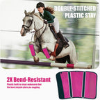 Side profile of a horse wearing pink breathable non slip fly boots in a pasture.