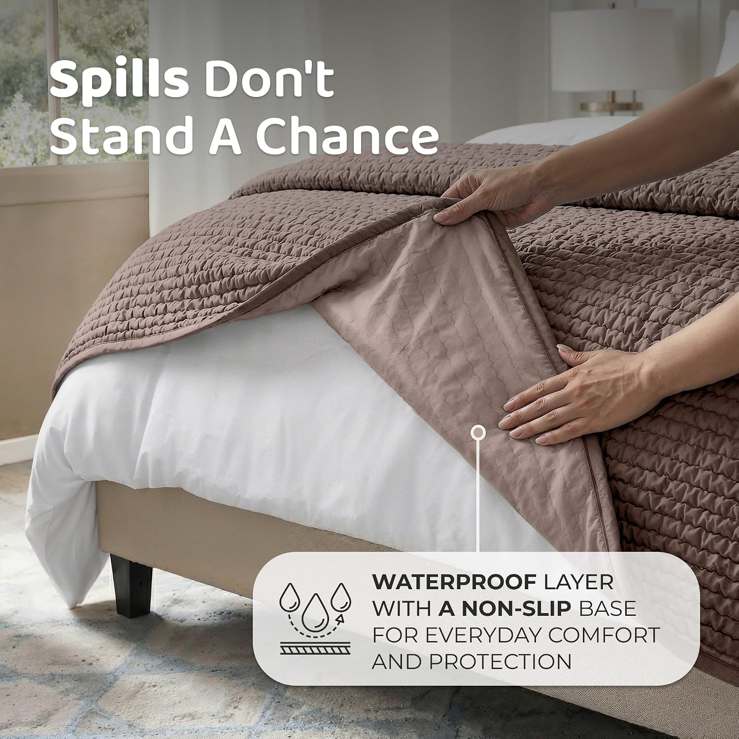 Soft taupe waterproof bed pad showing close up stitching quality