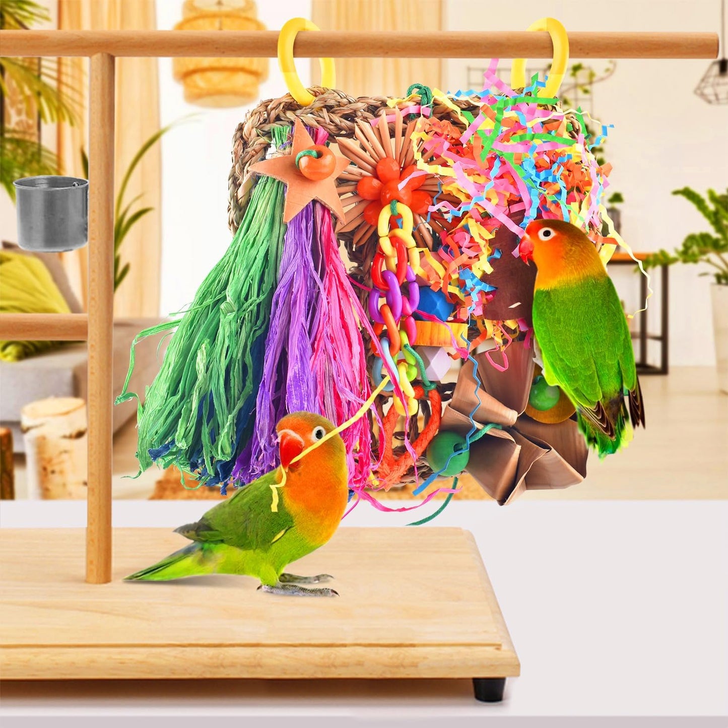 Small parakeet engaging with the bamboo and corn husk components of the KATUMO shredder toy.