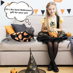 Side profile of small dog wearing black acrylic Halloween sweater