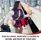 Person wearing red Fido Pro Airlift dog sling while hiking